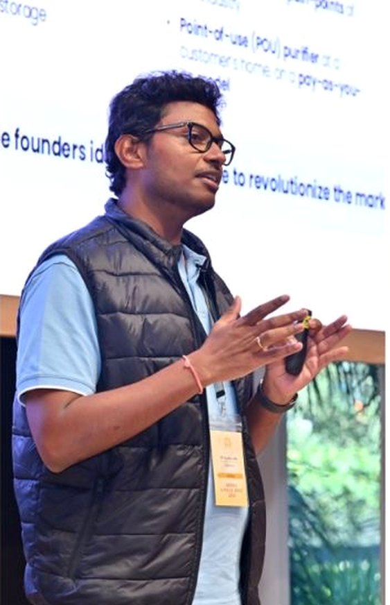 Portfolio founder speaking at an Artha gathering